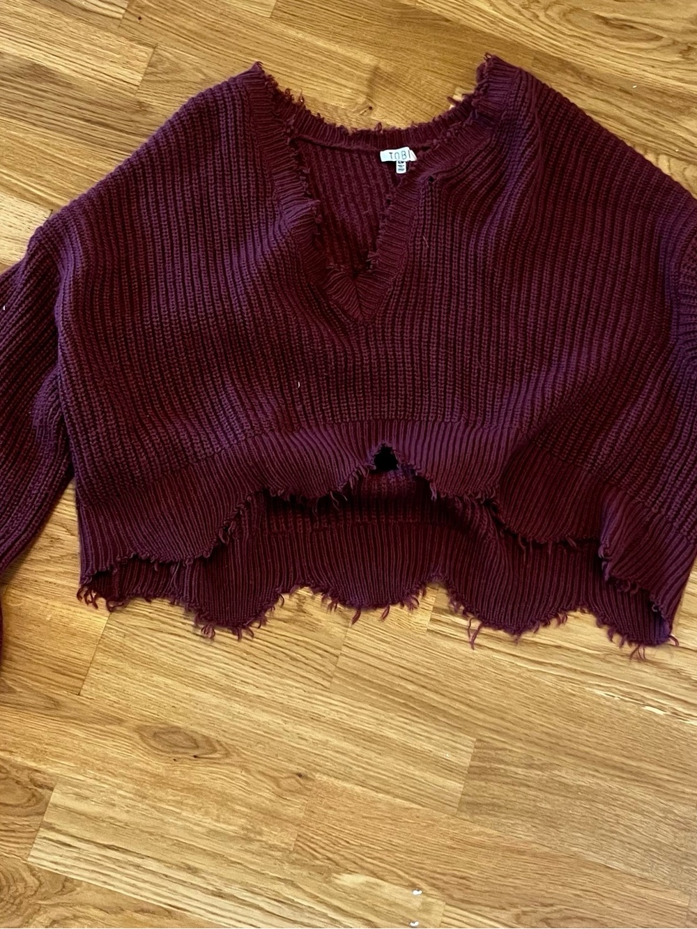 Tobi Cropped Distressed V-Neck Sweater in Burgundy
